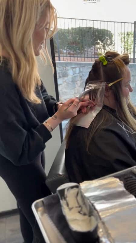 Adding blonde highlights to new growth.